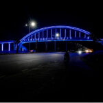 An attractive view of pedestrian bridge over 7th avenue beautifully decorated with lights in the holy fasting month of Ramadan
