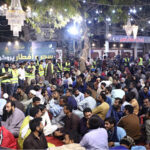 Volunteers serve food to the families at 'Sehri' during the holy fasting month of Ramzan ul Mubarak free meal distribution arranged by JDC Foundation Pakistan at Numaish Chowrangi