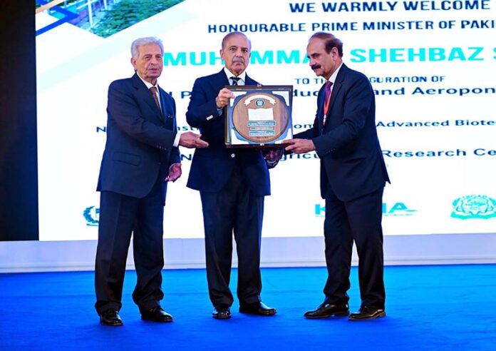 Prime Minister Muhammad Shehbaz Sharif distributes awards among the team of the Aeroponics Technology Complex for Potato Seed Production at the National Agricultural Research Centre