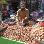 A vendor selling Dates on his cart at Muslim Bazar