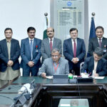 Registrar University of Sargodha Waqar Ahmad and MD Fitwell Saeed Gull sing the documents of intent of cooperation between the University of Sargodha and the Fitwell Hub. Vice Chancellor Prof. Dr. Qaisar Abbas witnesses the event.(UoS and Fitwell Hub agreed to establish student led Digital Clinic and Central Healthcare Hub)