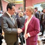 Minister of State for Interior Tallal Chaudhary shaking hands with British Home Secretary Yvette Cooper
