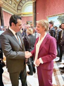 Minister of State for Interior Tallal Chaudhary shaking hands with British Home Secretary Yvette Cooper