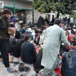 Volunteers serving free food to the fasting people during Iftar in the Islamic fasting month of Ramazan