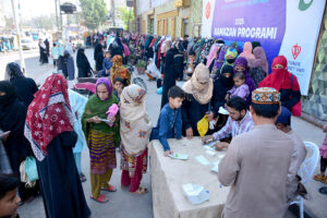 A large number of deserving women standing in queue to registration for Ramadan Gift during Ramadan Gift program donate by Turkiya Diyanet Foundation at Latifabad