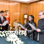 Acting President, Syed Yousuf Raza Gillani administering the oath of office of the Federal Minister to Syed Imran Ahmad Shah, during an oath-taking ceremony, at Aiwan-e-Sadr