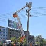 IESCO workers busy installed new electric wires on electric pole at IJP Road