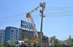 IESCO workers busy installed new electric wires on electric pole at IJP Road