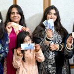 Girls happy to show their Eidi (Eid gifts) given by their elders during family get together on the third day of Eid Al-Fitr celebrations