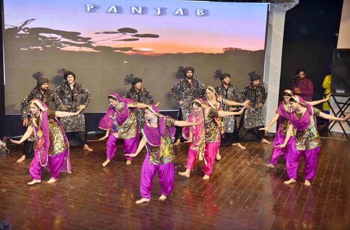 Artists perform a traditional cultural folk dance during Punjab Culture Day celebrations, organized by Punjab Arts Council Faisalabad Division