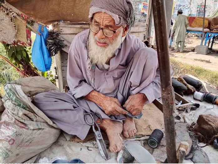 An elderly cobbler is busy with his routine work as the world observes May 1st as International Workers’ Day, also known as Labour Day