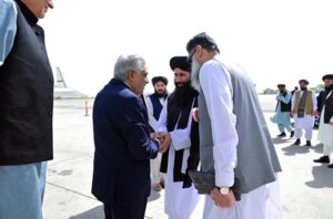 Deputy Prime Minister and Foreign Minister, Senator Mohammad Ishaq Dar shakes hand with the Acting Afghan Foreign Minister Amir Khan Muttaqi.