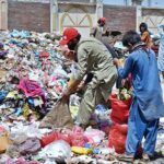 Gypsy youngsters search and collect valuables from a garbage heap along Lehtrar Road in the federal capital to earn their livelihood