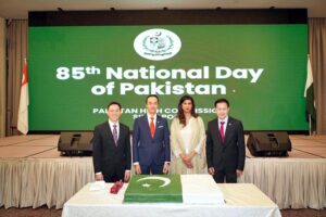 Pakistan's High Commissioner to Singapore Rabia Shafiq and Dr. Koh Poh Koon, Senior Minister of State, Ministry of Manpower and Ministry of Sustainability and the Environment cutting cake to celebrate 85th National Day of Pakistan at a reception.