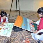 Student artists participate in a painting competition marking Punjab Culture Day organized by Punjab Arts Council Faisalabad Division