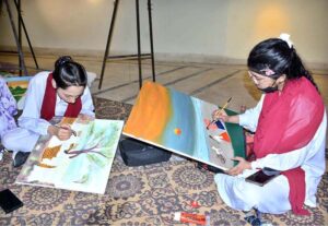 Student artists participate in a painting competition marking Punjab Culture Day organized by Punjab Arts Council Faisalabad Division