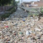 A clogged sewerage exit overflowing with garbage at New Green Town near Millat Road is causing environmental issues, demanding urgent attention from the concerned authorities