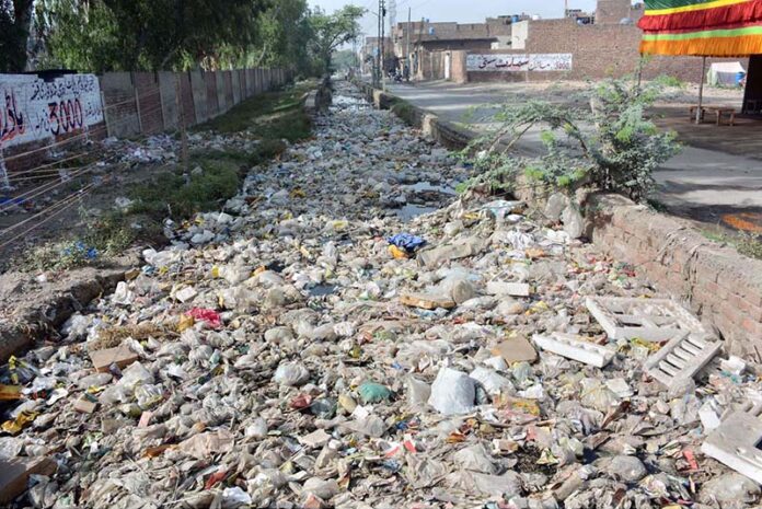 A clogged sewerage exit overflowing with garbage at New Green Town near Millat Road is causing environmental issues, demanding urgent attention from the concerned authorities
