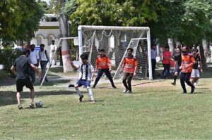 Players are in action in football match during Sports Galla at University of Sargodha