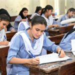 Students solving question paper during annual examination of SSC (part-I) 9th class at Government Girls Model School