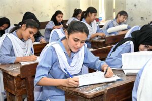 Students solving question paper during annual examination of SSC (part-I) 9th class at Government Girls Model School