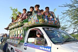 Youngsters dangerously ride atop a vehicle on Larkana-Moenjo Daro Airport Road, risking serious mishap and requires immediate action by the authorities.