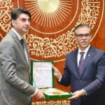 Dr Mukhtar Bharath State Minister Health is being Presented with memento during the National Symposium Primary Health Care Foundation of Universal Health Coverage at Agha Khan Hospital