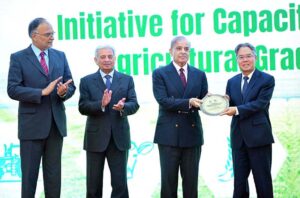 Prime Minister Muhammad Shehbaz Sharif awards shields to the team of Prime Minister's initiative of sending 1000 agriculture graduates for training in China for capacity building of Agricultural Sector in Pakistan.
