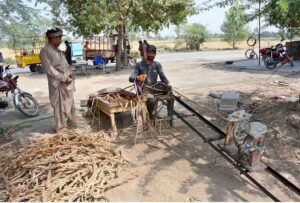 A craftsman repairs the sacks, ensuring that each one is ready for trade.