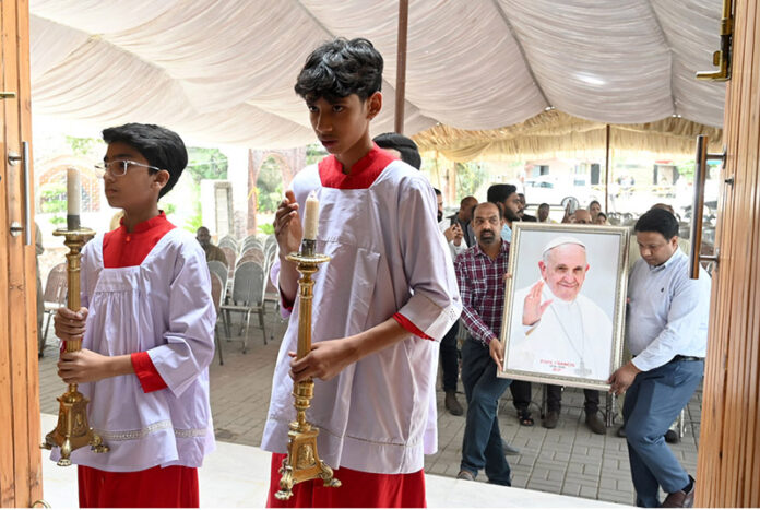 Pakistani Roman Catholic Christians and clergymen gather during the solemn mass for the soul of the deceased Pope Francis at Saint Joseph Cathedral Church in Rawalpindi. Pope Francis died on April 21 at the age of 88 years