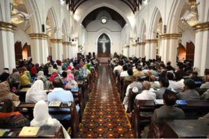 Members of the Christian community attend a solemn Good Friday Mass at St. John's Cathedral Church.