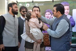Balochistan Health Minister Bakhat Muhammad Kakar administering polio drops to a child during inauguration of polio drive.