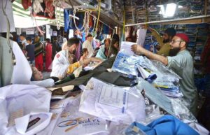 People busy in purchasing school uniform for their children at G-6 sunday bazar