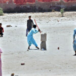 Youngsters are enjoying a cricket match at the local ground in their free time