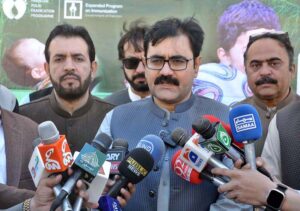 Balochistan Health Minister Bakhat Muhammad Kakar administering polio drops to a child during inauguration of polio drive.