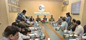 President Chamber of Commerce Sargodha Khawaja Yasir Qayyum and Principal Police Public High School Qurat-ul-Ain exchanging documents during MoU signing ceremony between Chamber of Commerce and Police Public High School DPO.