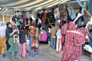 Vendor selling and displaying school bags to attract customers at G-6 Sunday Bazaar