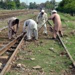 Railway workers busy in repairing a railway track near Shahdara Railway Station