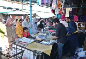 Vendor selling and displaying school bags to attract customers at G-6 Sunday Bazaar