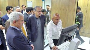 Interior Minister Mohsin Naqvi inspecting newly installed MRP and e-passport machines at Directorate General of Immigration and Passports.