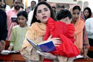 Christian community engaged in their religious rituals during Easter Sunday mass, commemorating the resurrection of Jesus as part of the Holy Week celebrations at St. Thomas Church, Civil Lines.