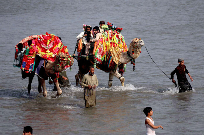 Visitors enjoying camel ride at Sardaryab picnic point on 3rd day of Eid ul Fitr celebrations