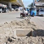 An open manhole poses a serious safety hazard for pedestrians at Manzoor Colony, demanding urgent attention from the concerned authorities