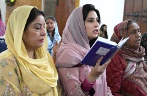 Christian community engaged in their religious rituals during Easter Sunday mass, commemorating the resurrection of Jesus as part of the Holy Week celebrations at St. Thomas Church, Civil Lines.