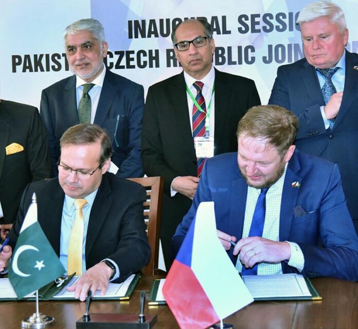 Muhammad Humair Karim, Special Secretary Ministry of Economic Affairs, and David Muller, Director General at the Czech Republic's Ministry of Industry and Trade, signing the protocols after the completion of first Joint Commission Meeting in federal capital