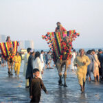 Children enjoying camel ride at sea view beach Clifton, on the 2nd day of Eid-ul-Fitr celebrations