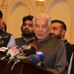Defense Minister Khawaja Muhammad Asif addressing PML-N workers during the Eid Milan party