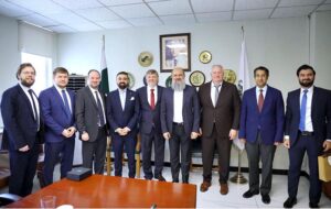 Federal Minister for Commerce Jam Kamal Khan and SPIMEX Vice President Dmitriy Chernyshev shake hands after a meeting on strengthening Pakistan-Russia trade ties