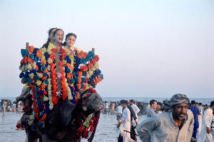Children enjoying camel ride at sea view beach Clifton, on the 2nd day of Eid-ul-Fitr celebrations