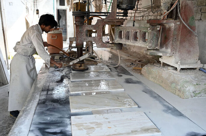 Worker busy in his routine work in a factory as the world marks 1st May as International Workers’ Day also known as Labour Day and often referred to as May Day, is a celebration of labourers and the working classes that is promoted by the international labour movement. The date was chosen in 1889 for political reasons by the Marxist International Socialist Congress, which met in Paris and established the Second International as a successor to the earlier International Workingmen’s Association. They adopted a resolution for a “Great International Demonstration” in support of working-class demands for the eight-hour day. The date had been chosen by the American Federation of Labor to continue an earlier campaign for the eight-hour day in the United States, which had been the cause of a general strike beginning on 1 May 1886, and culminated in the Haymarket affair, which occurred in Chicago four days later. May Day subsequently became an annual event